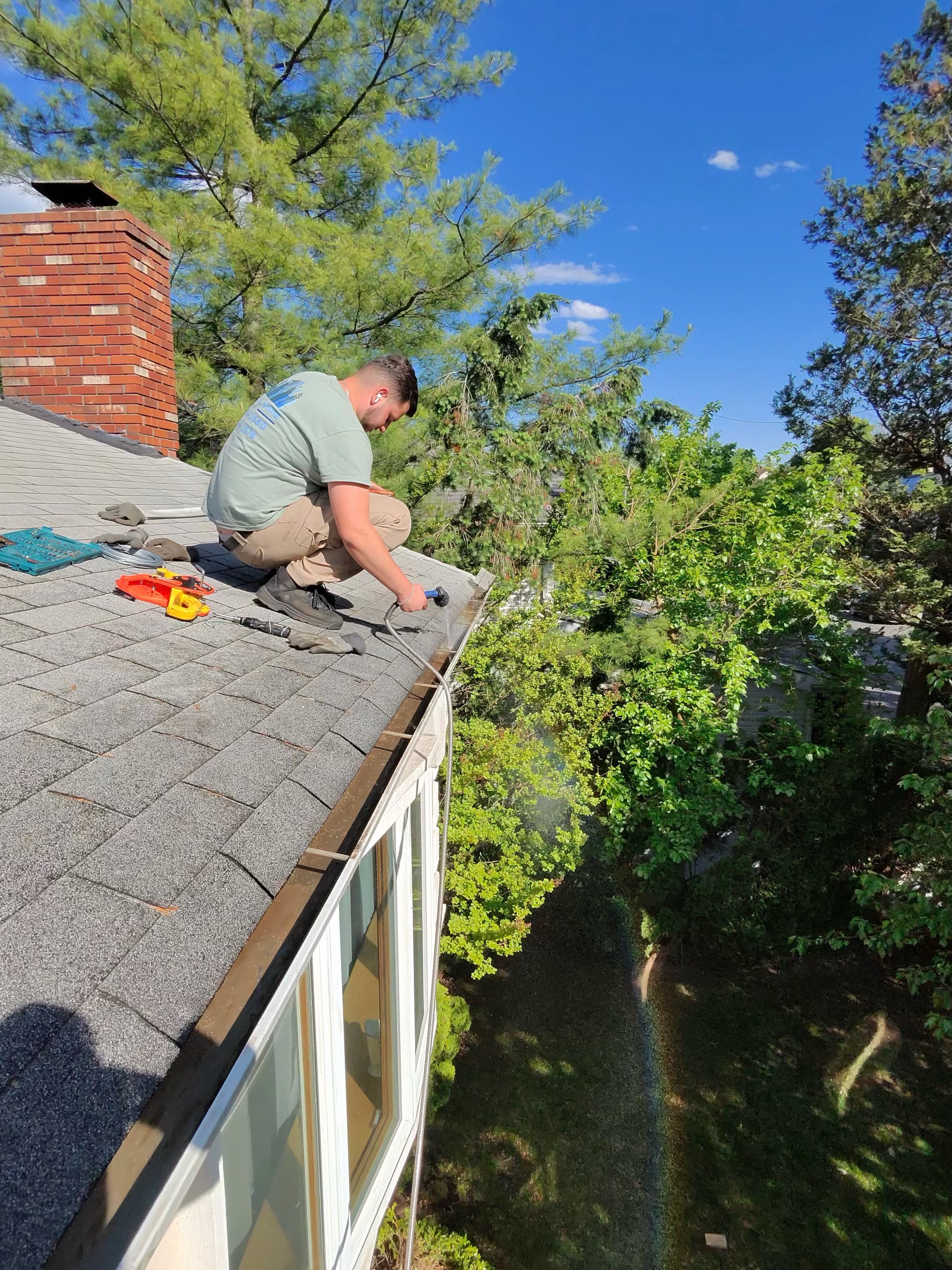 Gutter cleaning in progress